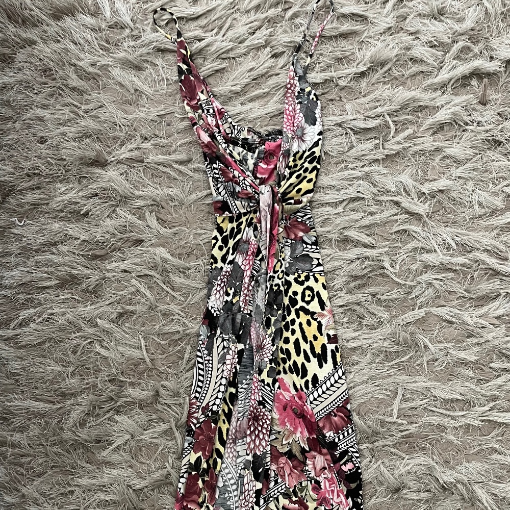 Spaghetti strap printed dress with slit.